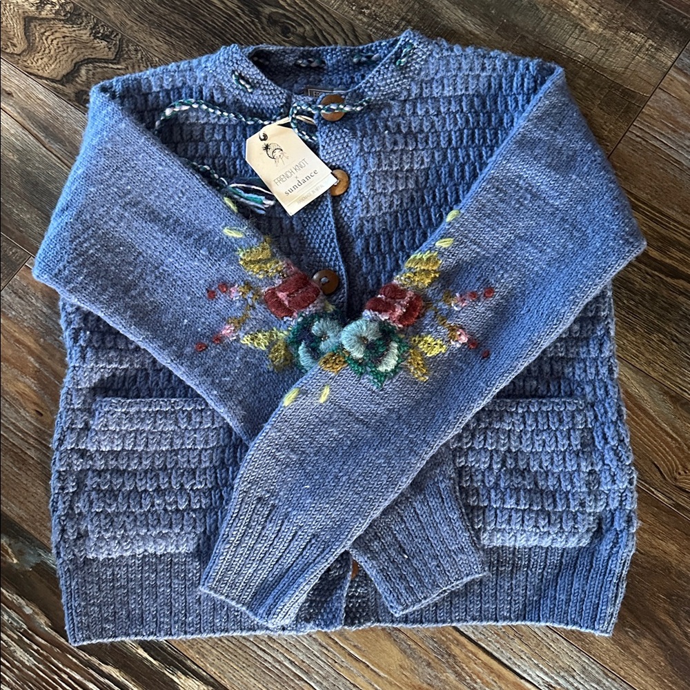 New sundance blue cardigan with floral accents. Was $298 . Size medium.